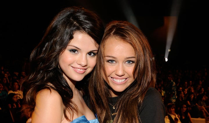 Actress Selena Gomez and host Miley Cyrus during the 2008 Teen Choice Awards at Gibson Amphitheater on August 3, 2008 in Los Angeles, California.