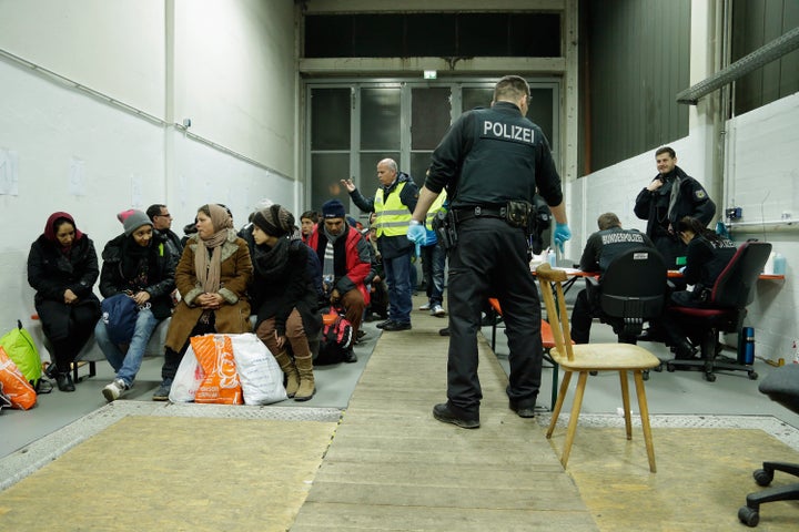 Swedish politicians are pressuring the government to start carrying out medical tests to vet the age of young refugees. Police register migrants and refugees at a processing center in Passau, Germany.