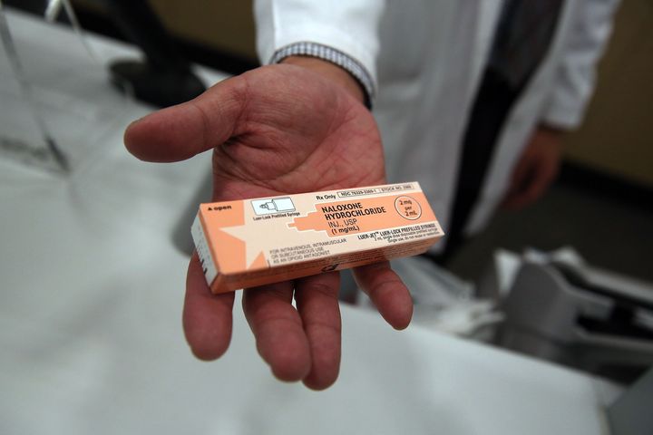 A pharmacist at a Walgreens store holds a box of the overdose antidote naloxone on Feb. 2 in New York City. Duane Reade and Walgreen Co. pharmacies have joined CVS in the city with giving out the heroin antidote without a prescription.