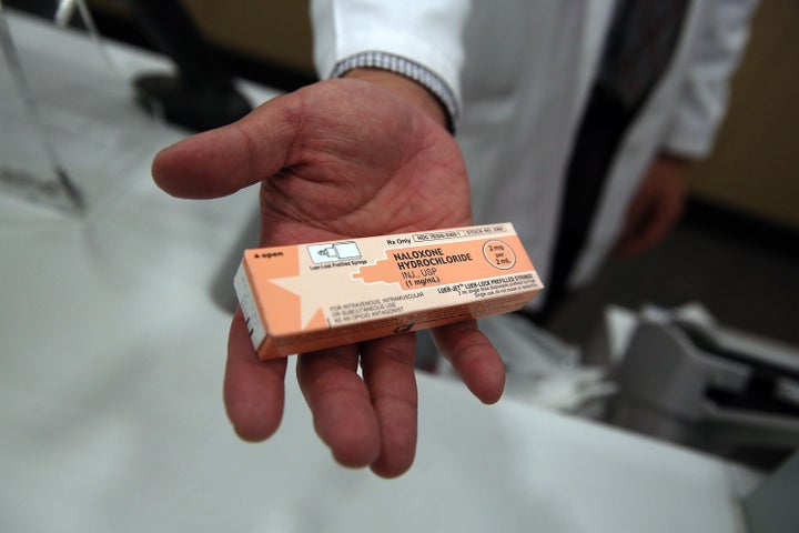 A pharmacist at a Walgreens store holds a box of the overdose antidote naloxone on Feb. 2 in New York City. Duane Reade and W