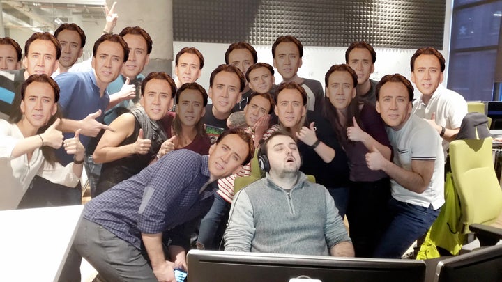 Guy Who Fell Asleep At Work surrounded by Nicholas Cages.