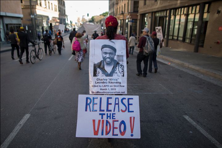 A protester last October calls for release of Los Angeles police video of Charly Keunang's death.