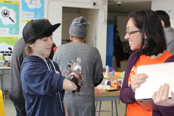 Kate Ganim with Kieren, 13, who called his project the “Nubinator,” a hand with LED lights and aluminum attachment to allow carrying heavier loads.