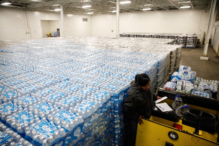 Pallets of bottled water are seen ready for distribution in a warehouse Jan. 21, 2016 in Flint, Michigan. Millions of bottles of water have been donated to residents whose water has been contaminated with lead.