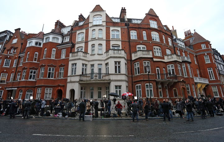Members of the media wait outside the Ecuadorian embassy where Wikileaks founder Julian Assange continues to seek asylum foll