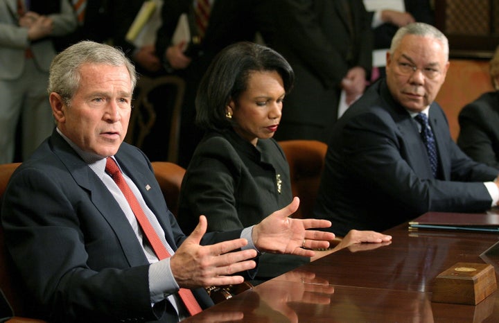 President George W. Bush, Secretary of State Condoleezza Rice, and former Secretary of State Colin Powell meet with other for