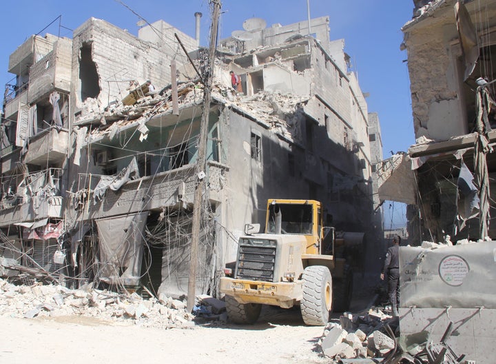 Damaged buildings are seen after Russian airstrikes on Aleppo. Rebel forces in Aleppo have declared a state of emergency in the city, demanding that all fighters and administrators join in the battle. Some 800,000 people are trapped in the city, and all shops are empty.