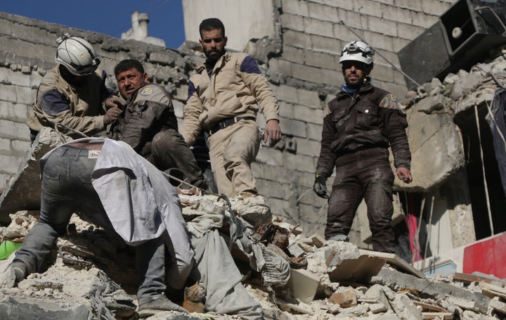 Syria's civil defense team searches for casualties after airstrikes on an opposition-held area of Aleppo on Thursday. The battles raging around Aleppo have added thousands more Syrians to the 4.5 million people already cut off from aid.