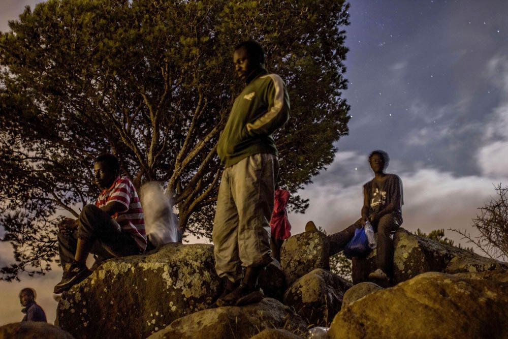 Men from Cameroon hide out in the mountains near Melilla. 