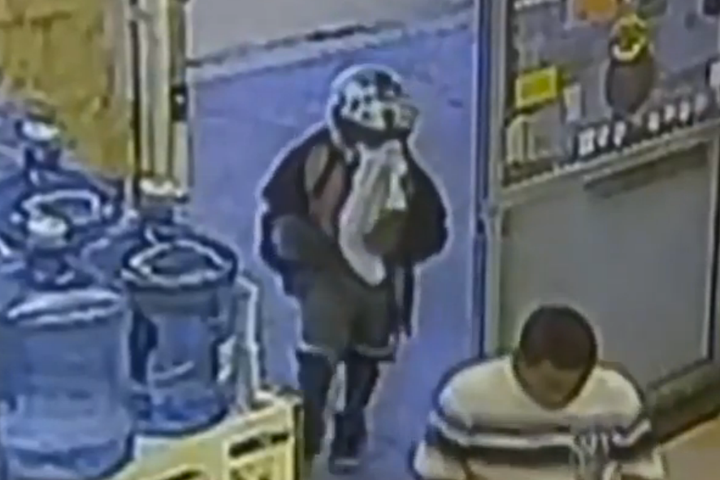 Surveillance video from a grocery store in West Palm Beach, Florida, shows an 8-year-old boy enter before attempting to rob t