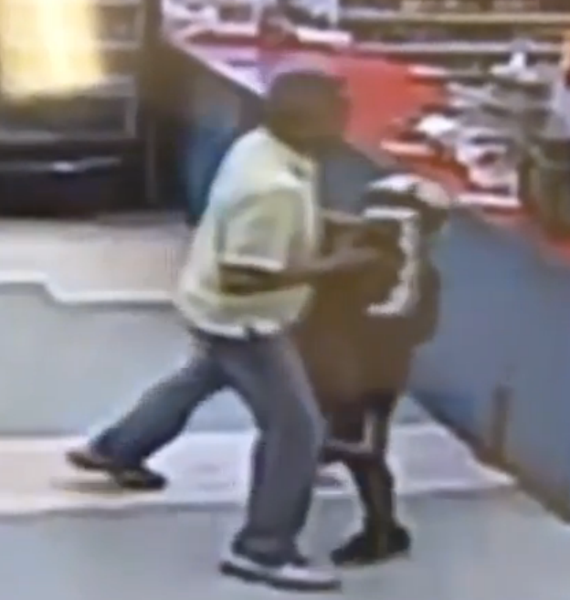 Surveillance video from a grocery store in West Palm Beach, Florida, shows an employee attempted to wrestle a gun away from a