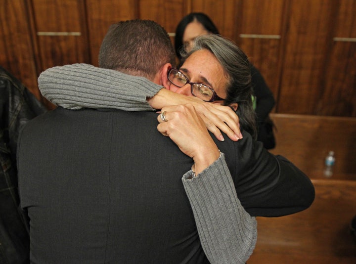 Carolyn Knox, mother of murder victim Jennifer Alfonso, receives a hug from Miami-Dade homocide Det. Jonathan Grossman after Derek Medina was found guilty of second-degree murder in November 2015.