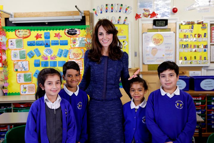 Catherine, Duchess of Cambridge poses for a photo with (L-R) Nimra, 10, Ryan, 10, Bailey-Rae, 7, and Connor, 11, from Salusbury Primary School in Queen's Park, London, during filming of a video message for Children's Mental Health week.