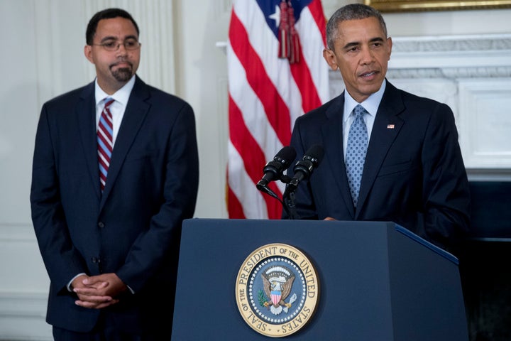 Acting Education Secretary John King Jr. with President Barack Obama in the White House in 2015. King announced a new department oversight unit on Monday.