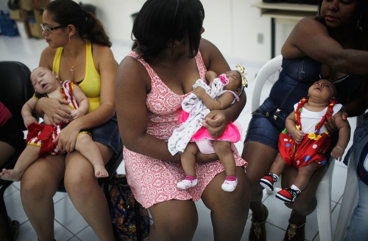 Babies born with microcephaly are dressed in Carnival outfits at a party in a health clinic on February 4, 2016 in Recife, Brazil.