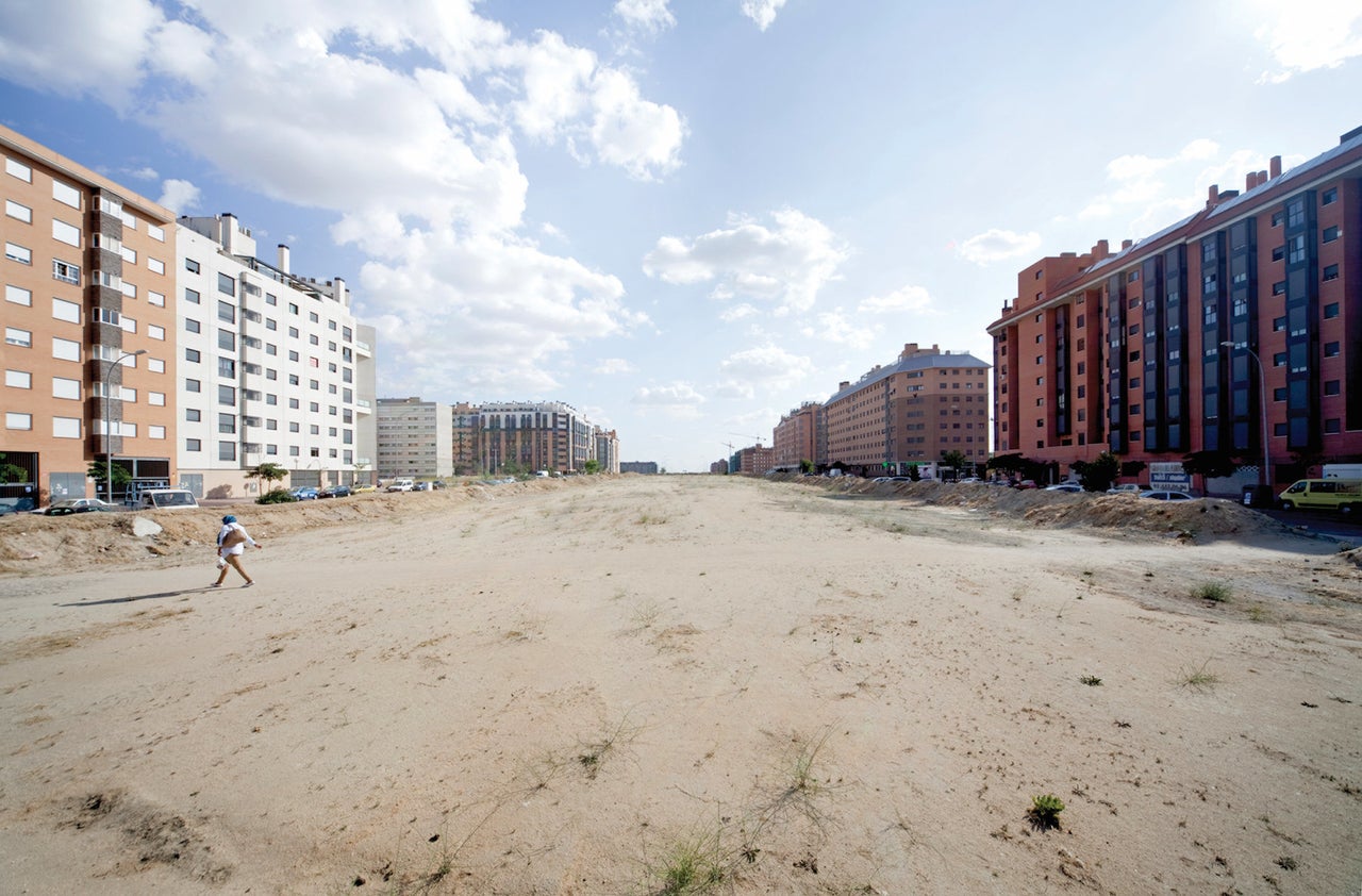 Large and incomplete public spaces throughout the Ensanche de Vallecas development near Madrid, shown in 2014, exacerbates the sense of emptiness and abandonment.