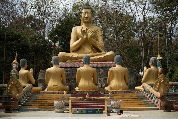 Take another look at this statue of Buddha in Kampong Thom, Cambodia. The gesture he's making with his hands is called a mudra.