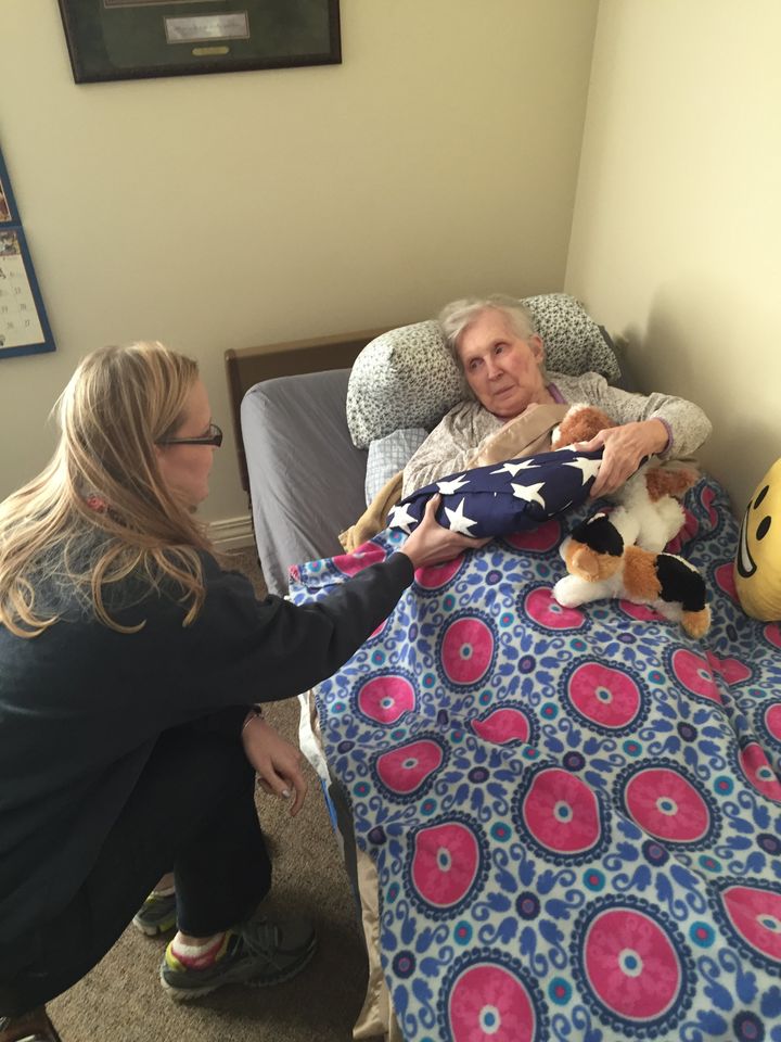 A poignant moment between Mary and the couple's granddaughter Christy. A few days before Mary's passing, Christy presented her with Marvin's honor flag, which he received for serving in the Korean War. 