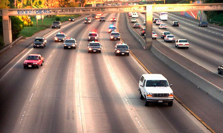 O.J. Simpson is trailed by LAPD cars as it travels along a California freeway.