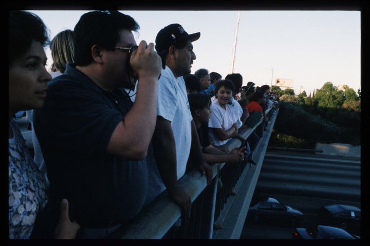 Supporters of O.J. Simpson gather on an overpass along a California freeway.