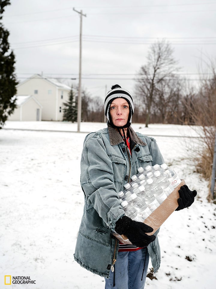Julie Bennett.<br><br>Bennett is pictured after picking up a pallet of bottled water. Flint's mayor estimates that it co