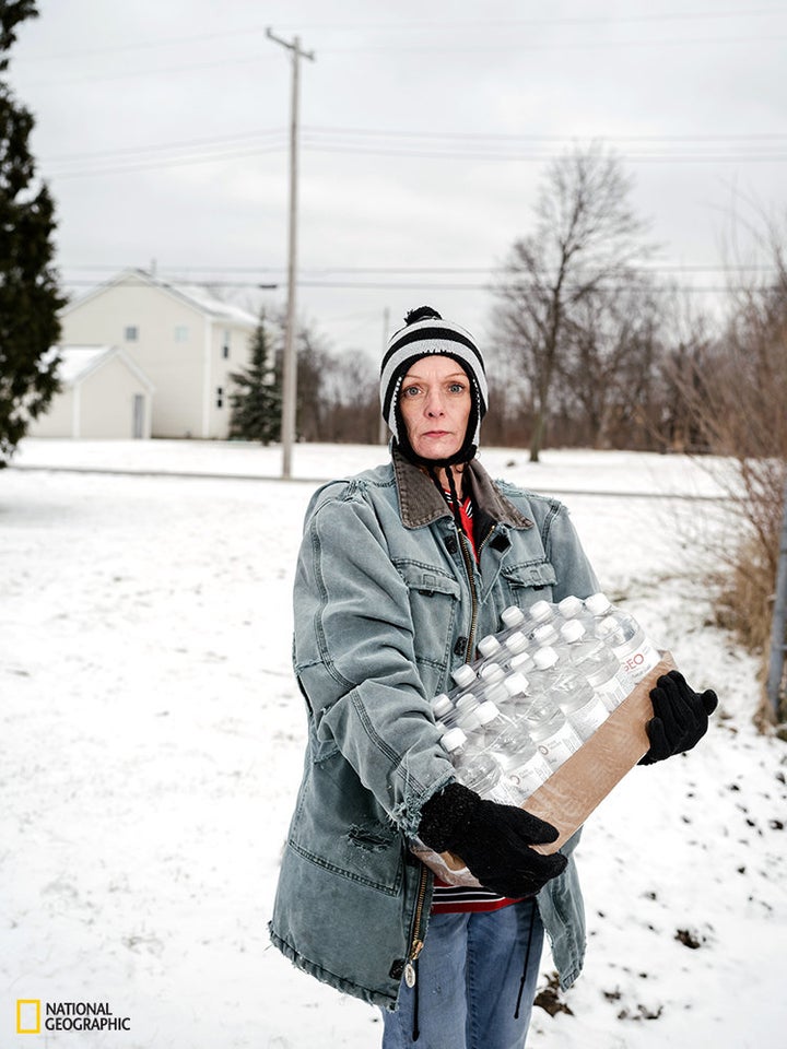 Julie Bennett.Bennett is pictured after picking up a pallet of bottled water. Flint's mayor estimates that it could cost $1.5 billion -- and take an untold amount of time -- to replace the city's water pipes.