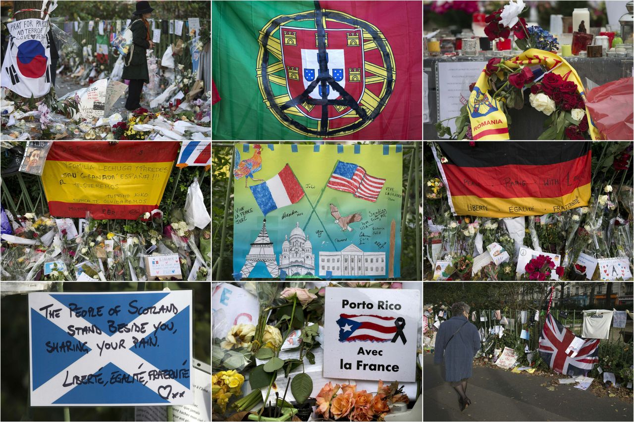 A combination made with pictures taken on November and December 2015 shows foreign tributes at a makeshift memorial near the Bataclan concert hall in tribute to the victims of November 13 terror attacks in Paris. (From top L) A flag of South Korea, a flag of Portugal, a Romania scarf, a flag of Spain, a child's drawing with the national flag of France (L) and the national flag of United States, a flag of Germany, a flag of Scotland, a placard bearing the Puerto Rico national flag and reading 'Puerto Rico with France', and a British Union Jack flag.