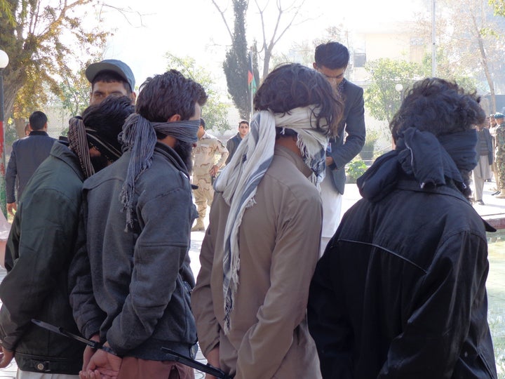 Four suspected members of the Islamic State are blindfolded by Afghan forces in Nangarhar, Afghanistan, on Jan