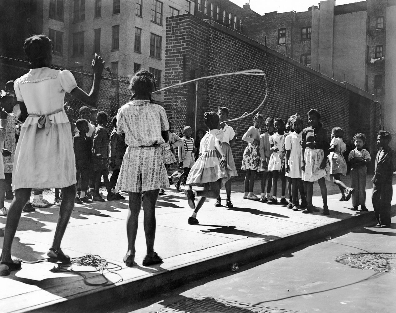 1946: Rope skipping on a block in Harlem, where Zora Neale Hurston led a group of women who were working to bring joy and "stem youthful delinquency" with activities, trips and games.