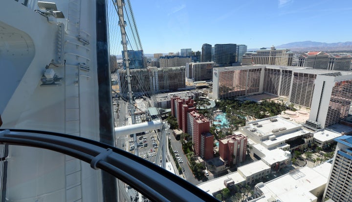 The couple allegedly refused a security guard's orders. Instead they carried on and were filmed by other guests on the glass ride that's seen from the inside here.