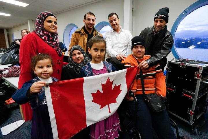 A Syrian family, sponsored by a local group called Ripple Refugee Project, attends a dinner for refugees at the Toronto Port Authority.