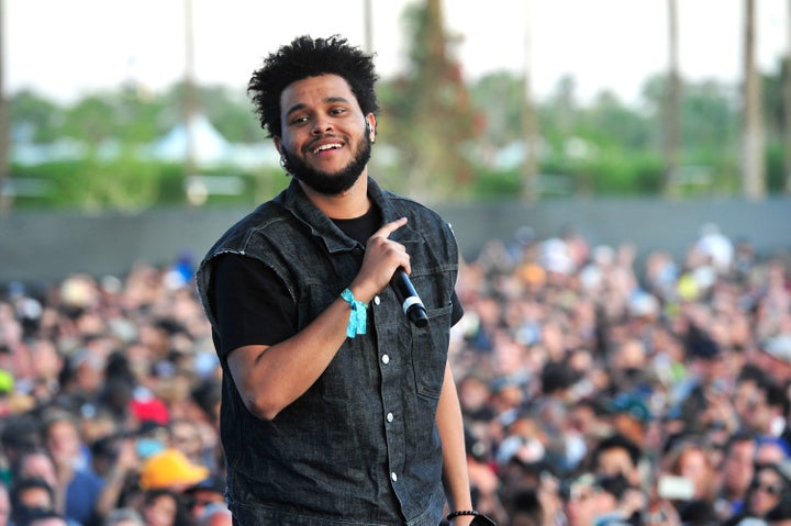 The Weeknd chats on the phone during a holiday shopping excursion in  Beverly Hills