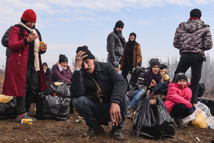 People rest after crossing the Macedonian border into Serbia in January. Migrants are trying to move north as fast as possible, fearing European countries may further restrict entry, aid workers said.