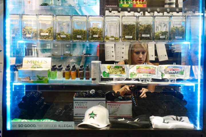 Budtender Kirsten Duncan refills plastic jars at Starbuds in Aurora, Colorado, in September, 2015.