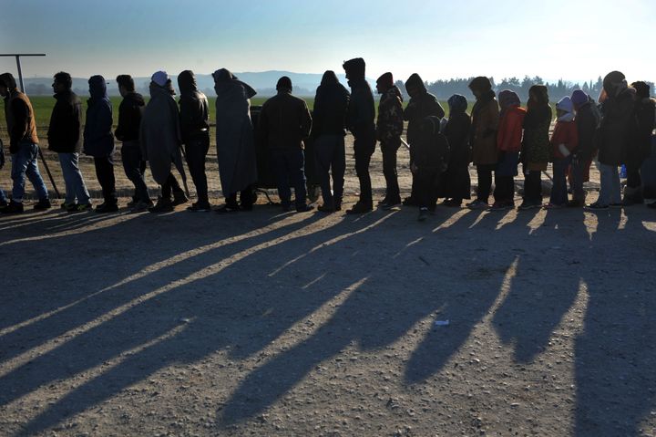 People line up to receive food near Idomeni, Jan. 21, 2016. Some Greek locals have organized protests and obstructed the construction of some registration centers.