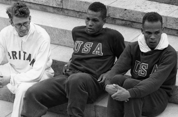 Archibald Williams (center) after winning the 400-meter race.