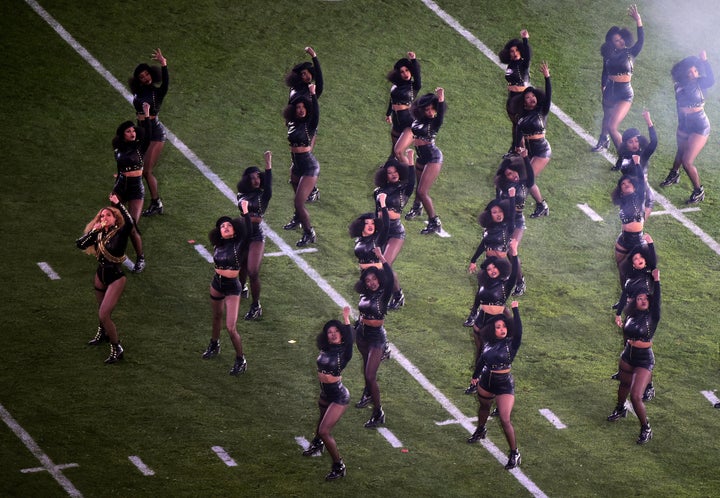 Beyonce and her dancers in Black Panther-inspired outfits dance during the Super Bowl 50 halftime show.
