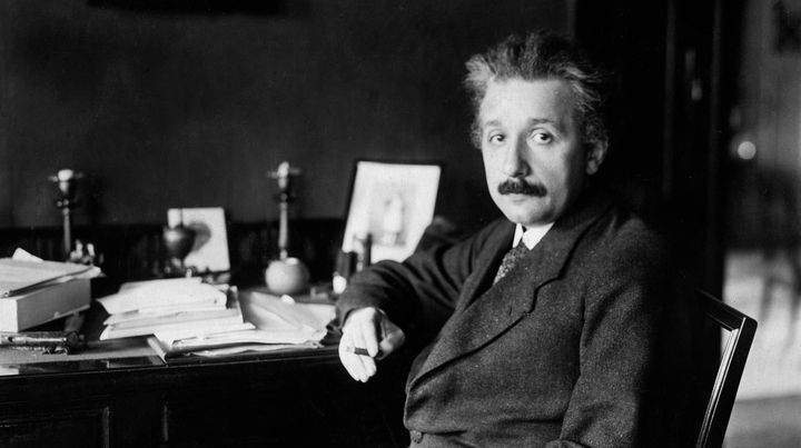 Albert Einstein at his desk in Germany in 1929. It was years prior, in 1916, when he predicted the existence of gravitational waves as part of the theory of general relativity.