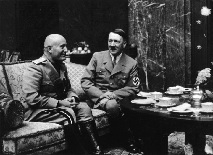Hitler and Benito Mussolini drink tea in Munich in 1937.