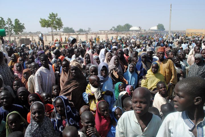 People wait for food at Dikwa camp earlier this month. The camp for people displaced by violence was hit by a twin suicide bombing on Tuesday, claiming dozens of lives.