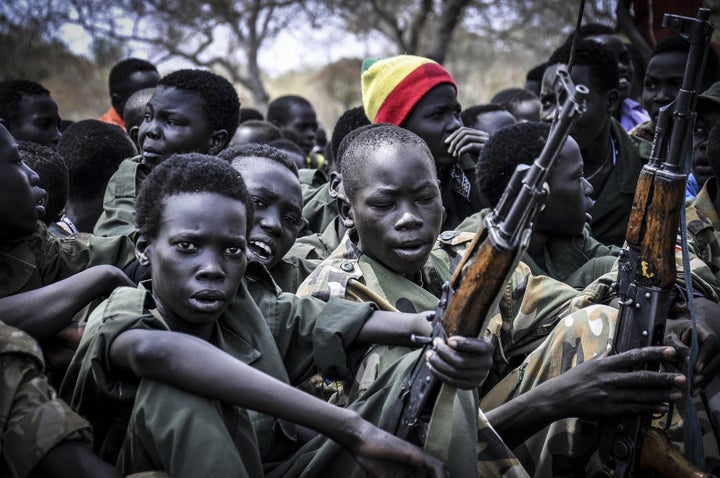 Young boys appear at a disarmament, demobilization and reintegration ceremony in South Sudan in 2015.