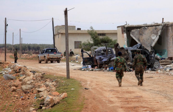 Syrian government forces patrol after taking control of the village of Kiffin, on the northern outskirts of the embattled city of Aleppo on the road leading to Gaziantep, from opposition forces on February 11, 2016.