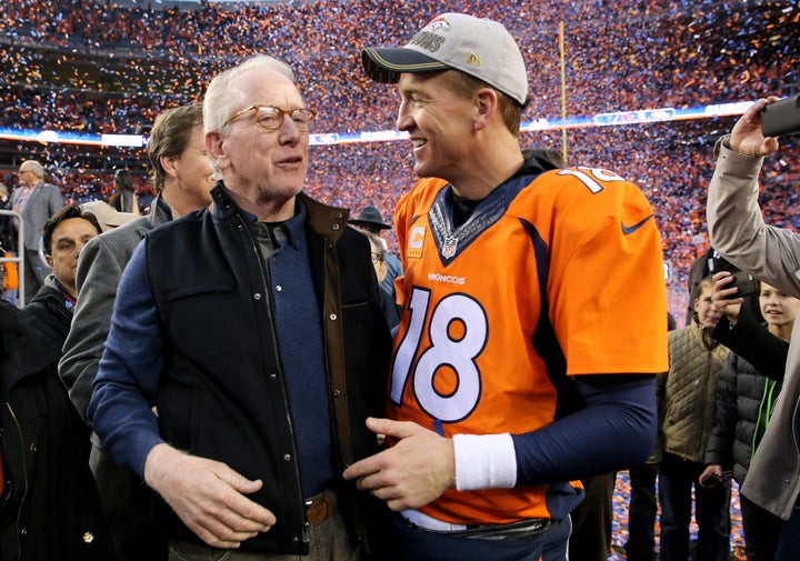 Peyton and father Archie Manning walk off the field after the Denver Broncos defeated the New England Patriots in the AFC Championship on Jan. 24, 2016 in Denver, Colorado.