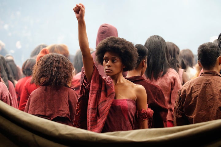 Model Elyssa Nicole raises black power fist.