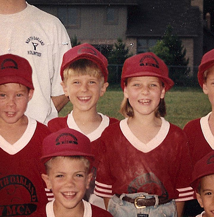 Jordin and Curtis, standing side-by-side in the center. The two played on the same t-ball team as kids and started dating in high school in 2005.