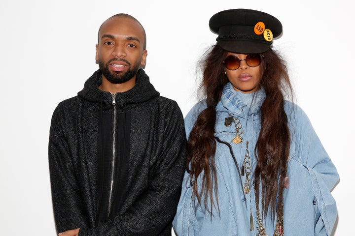 Fashion designer Kerby Jean-Raymond and stylist and singer-songwriter Erykah Badu pose backstage at the Pyer Moss Fall 2016 fashion show.