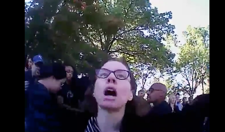 Mizzou professor Melissa Click stands between police and activists at the university homecoming parade on Oct. 10, 2015.