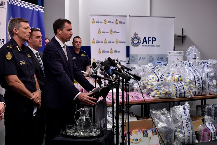 Justice Minister Michael Keenan, second from the right, speaks at a press conference during a presentation of the seized crystal methamphetamine.