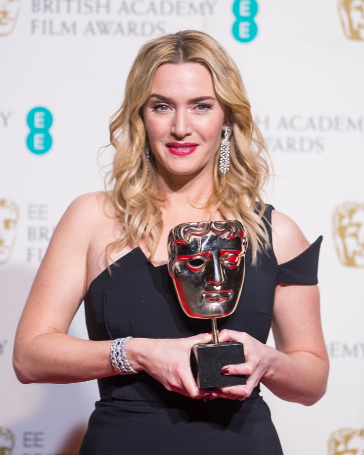 Kate Winslet poses in the winners room at the EE British Academy Film Awards at The Royal Opera House on February 14, 2016 in London, England