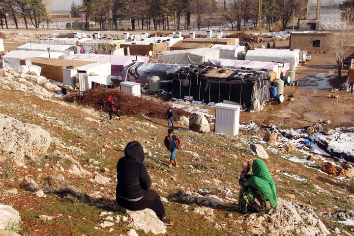 People rest at an unofficial refugee camp in Bar Elias, Lebanon. Many of the refugee women said food vouchers from the U.N. had decreased or stopped altogether. For some of them, it was their main source of income.